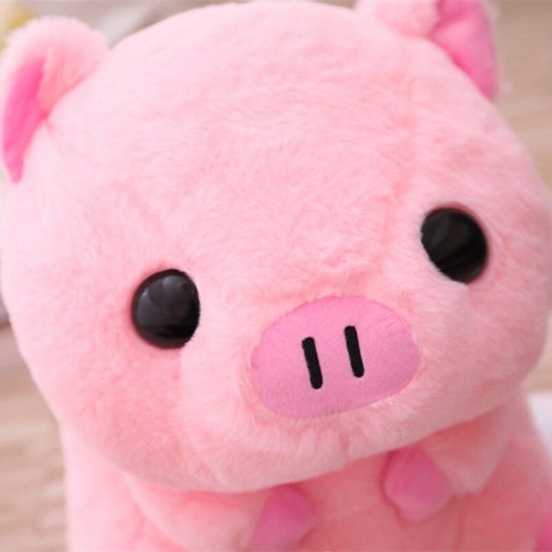 A close-up of the piggy plushie's face, highlighting its adorable facial features, soft fabric, and friendly appearance.