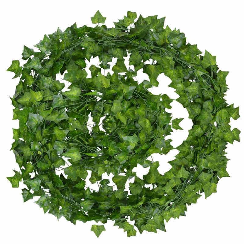 A close-up of a green ivy wreath with white butterflies, embodying a cheerful and nature-inspired room decor.
