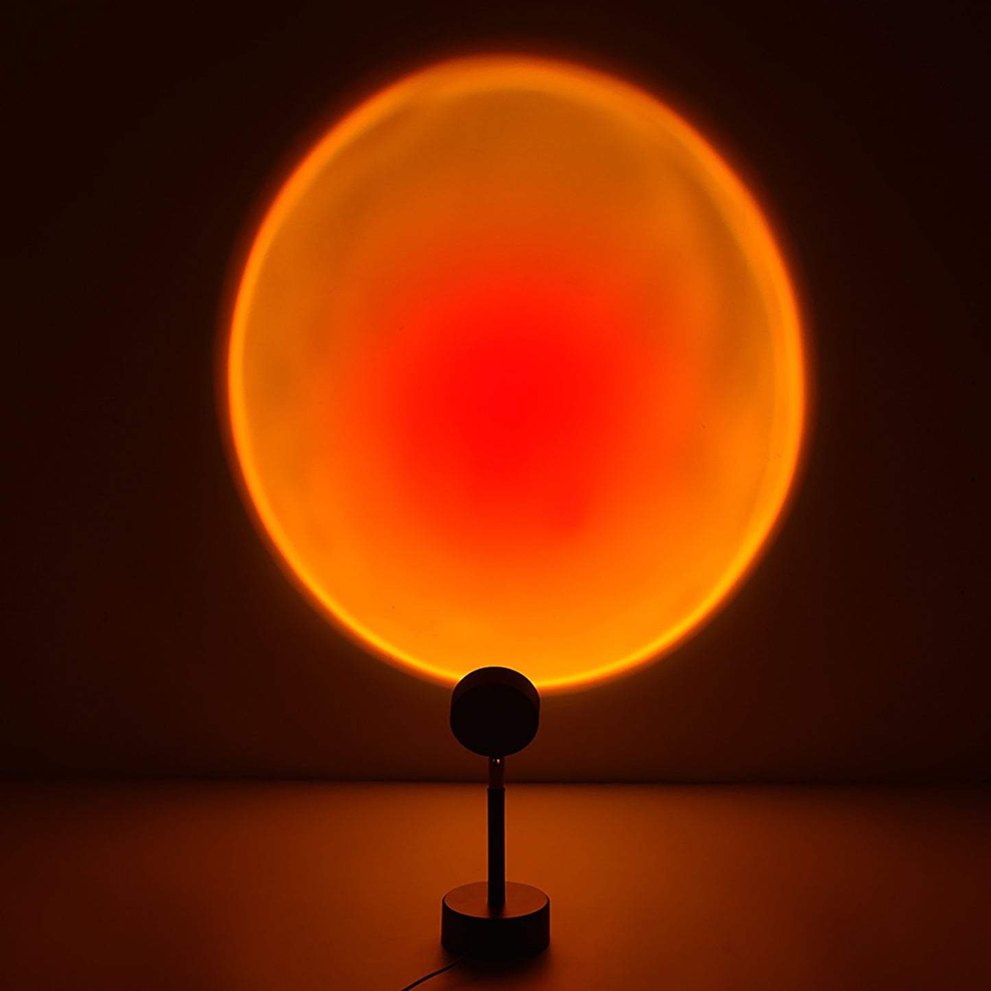 A round lamp projects a large, bright orange circle onto the wall, resembling the sun.