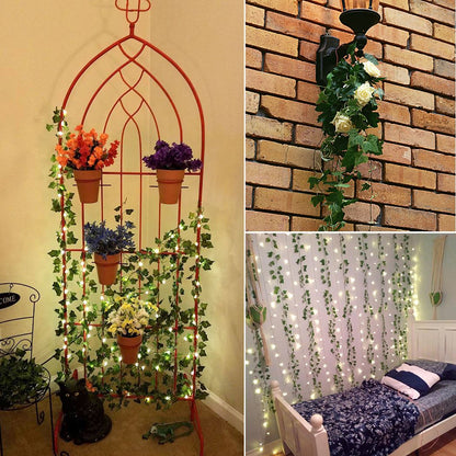 A red metal trellis adorned with green ivy and colorful potted flowers, set against a beige wall, suggesting a boho room decor.