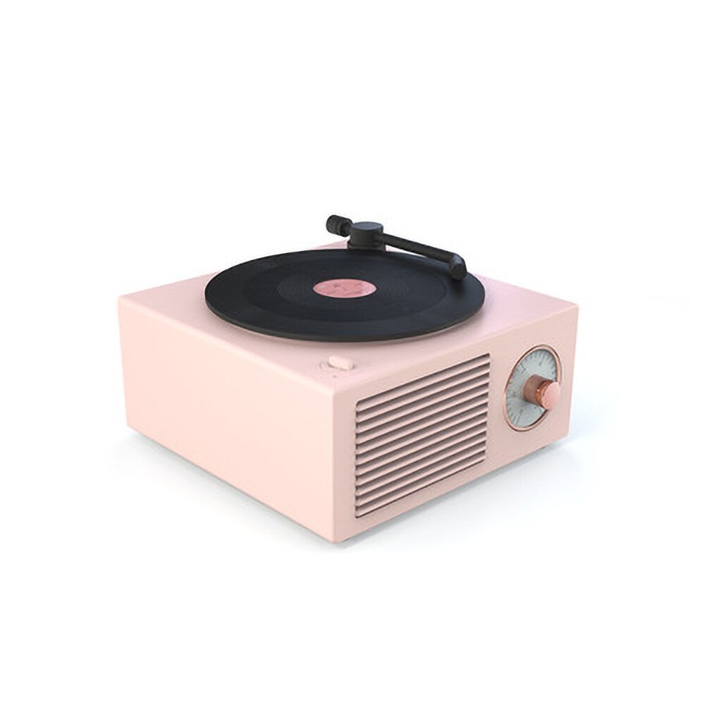 A pastel pink retro Bluetooth speaker with a vinyl record design, featuring a single copper-colored control knob and a front speaker grille. The design combines vintage charm with a soft, modern color.