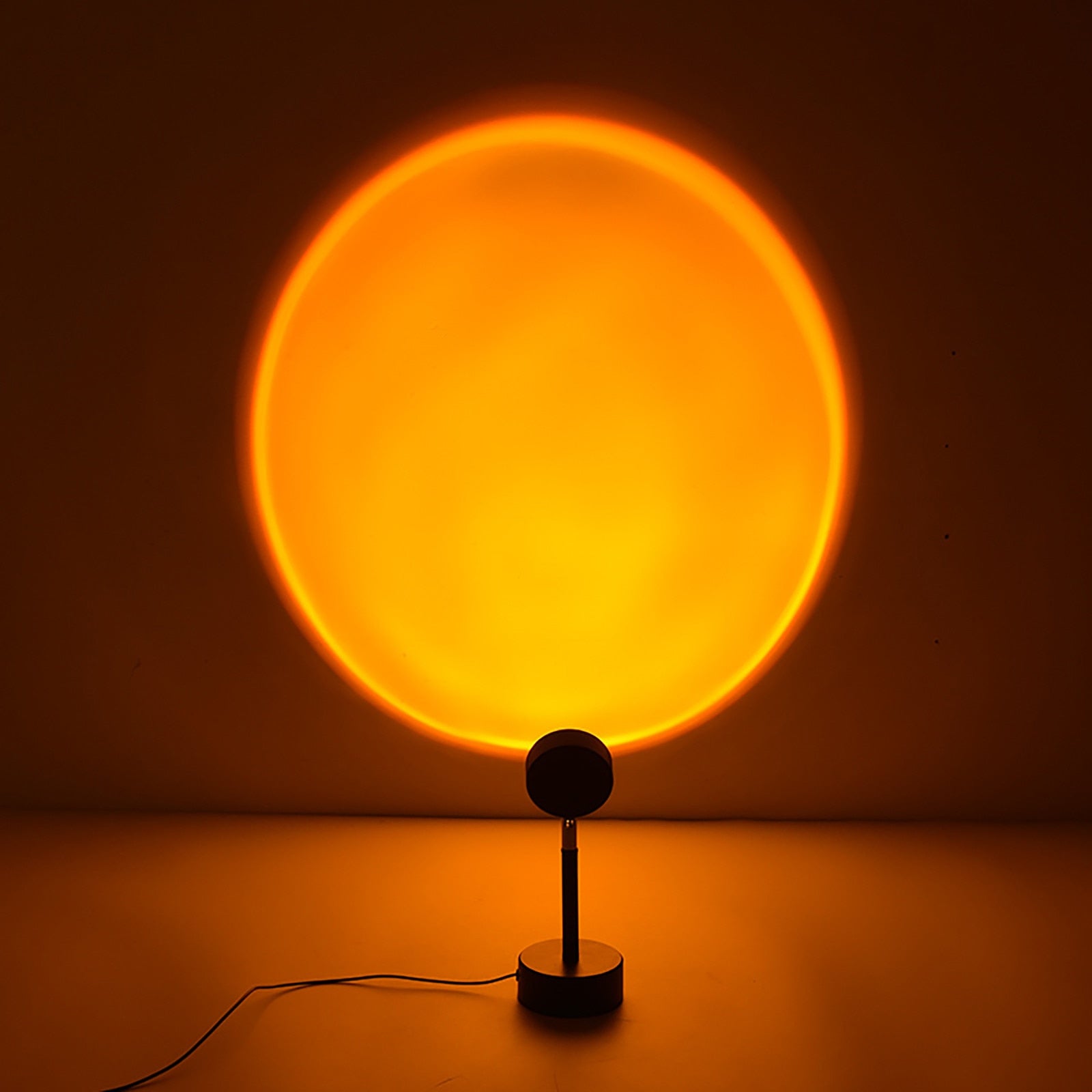 yellow-to-orange gradient light circle on a wall, resembling a sunset, ideal for creating a warm, cozy atmosphere in a room.