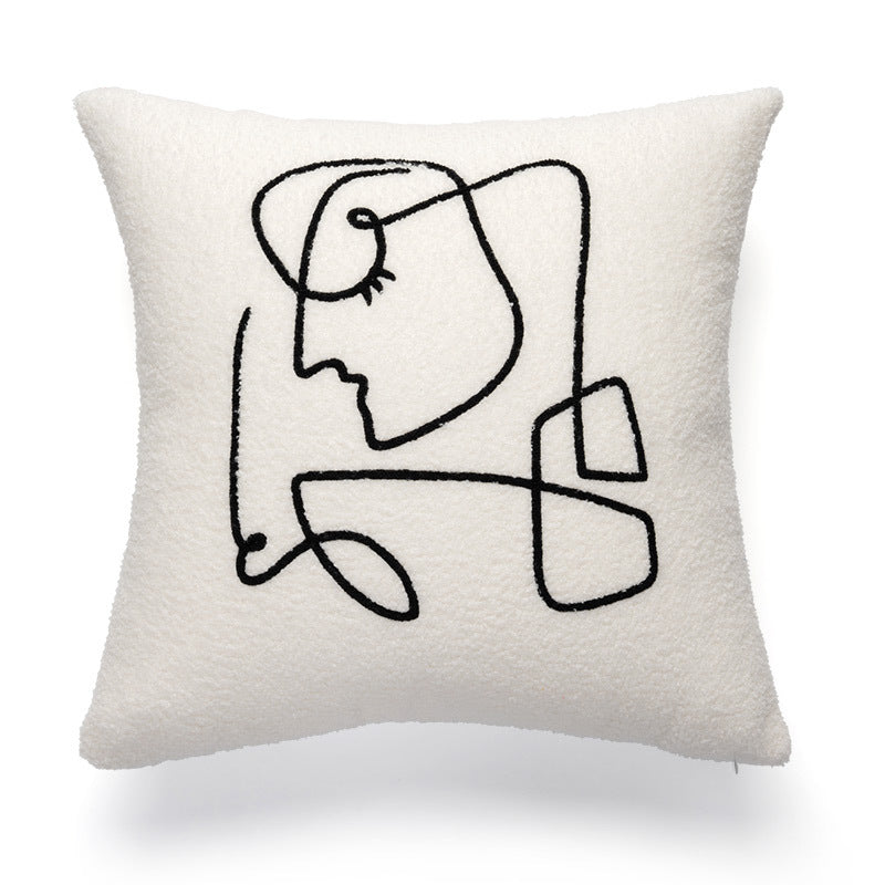 A cream-colored pillowcase with a textured surface showcases a bold black abstract line art of a woman's profile, including an eye with lashes, a nose, and lips. This pillowcase represents the 'Art Hoe' style and would be a chic addition to a variety of decor themes such as 'Boho', 'Coquette', 'Cottagecore', 'Danish Pastel', and would fit perfectly in a 'Dorm Room', 'Dreamy', 'Feminine', or 'Relaxing Room' environment.