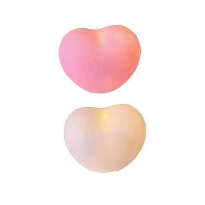 Two heart-shaped lamps in gradient pink and white colors, isolated on a white background. These lamps are part of the 'bedside-lamps' and 'dreamy-room-decor' collections, adding a romantic and soft glow to any space.