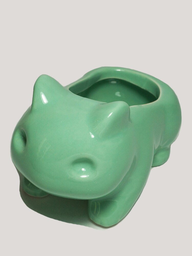 Angle view of a kawaii green frog planter, a delightful room accessory for those who love unique decor or are looking for gift ideas within gifts under 25$
