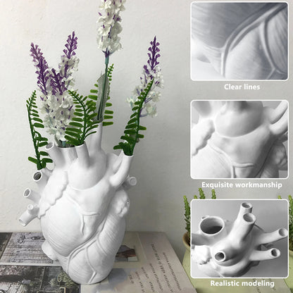 The white heart vase is filled with various flowers, with insets showing the product's clear lines, exquisite workmanship, and realistic modeling, emphasizing its craftsmanship.